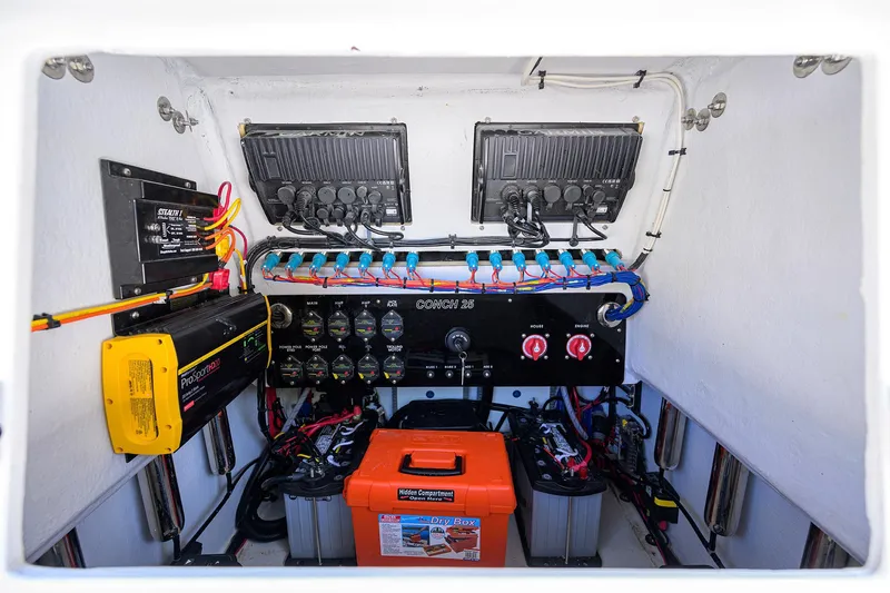 Slide: The Image of Electrical system of 2024 Conch 25 boat with wiring and battery setup. - 26