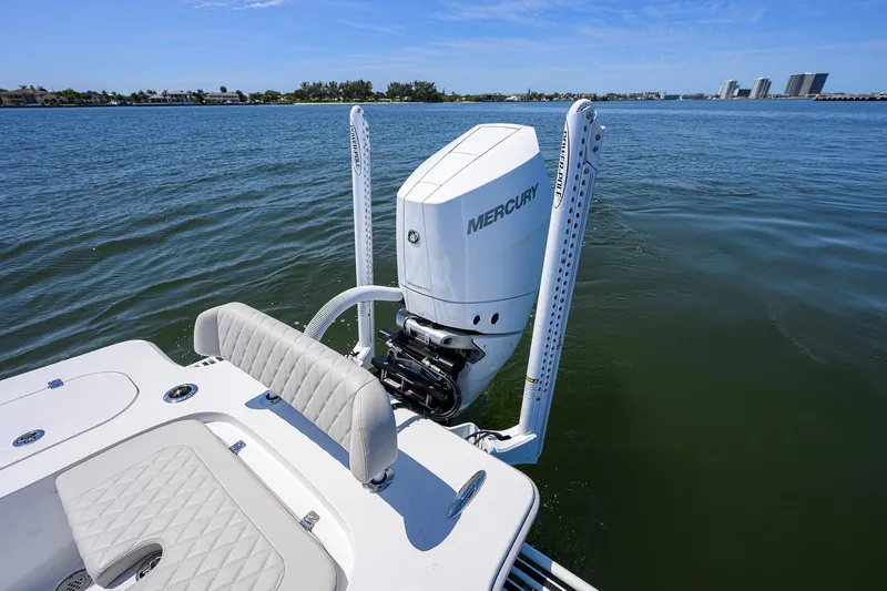 Slide: The Image of 2024 Conch 25 boat with Mercury outboard motor on calm water. - 29