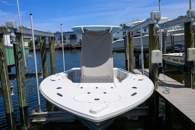 Slide: The Image of 2024 Conch 25 boat docked at marina, featuring sleek design and modern amenities. - 30