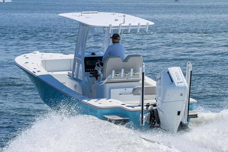 Slide: The Image of 2024 Conch 25 boat cruising on open water, rear view. - 37