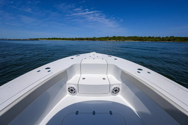 Slide: The Image of 2024 Conch 25 boat on calm water with clear blue sky. - 7