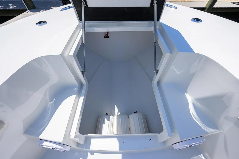Slide: The Image of 2024 Conch 25 boat interior storage compartment, open and spacious design. - 8
