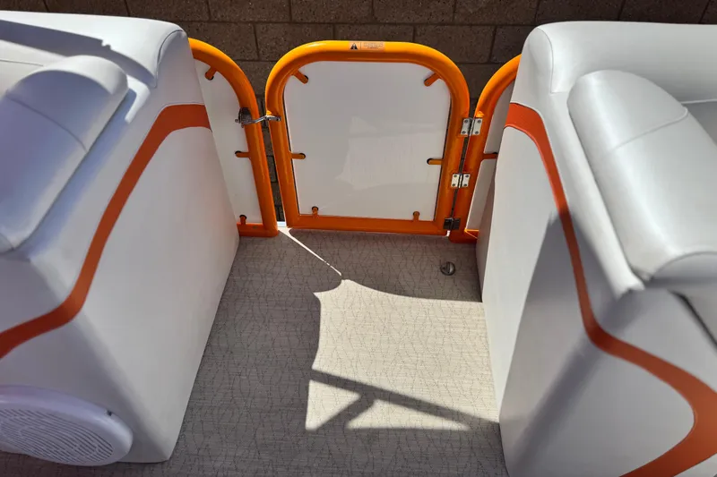 Slide: The Image of 2022 Aloha Pontoon 230 interior with orange accents and open gate. - 16