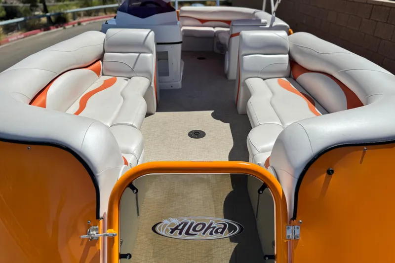 Slide: The Image of 2022 Aloha Pontoon 230 with spacious seating and vibrant orange accents. - 8