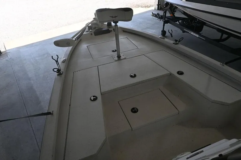 Slide: The Image of 2020 Vexus AVX1980CC boat interior with storage compartments and trolling motor. - 9