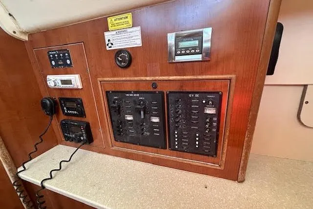 Slide: The Image of Electrical control panel in a 2013 Gemini Legacy boat interior. - 12