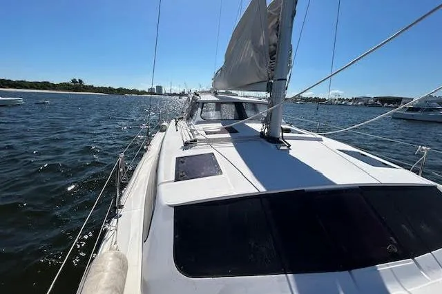 Slide: The Image of Sailing yacht Gemini Legacy 2013 on open water under clear blue sky. - 13