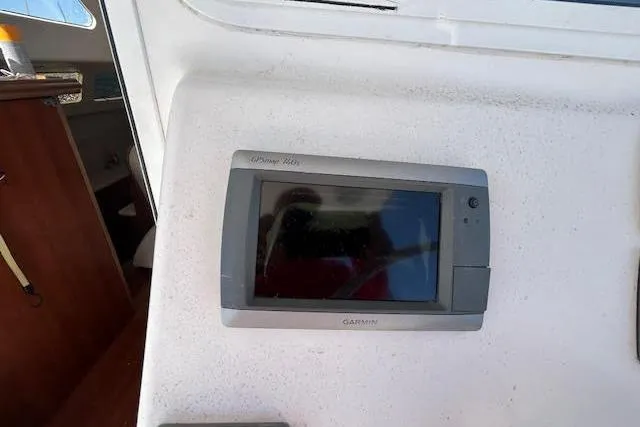 Slide: The Image of Garmin GPS device on 2013 Gemini Legacy boat dashboard. - 23