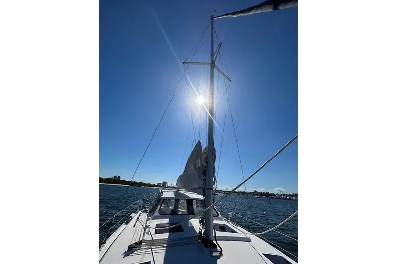 Slide: The Image of Sailing on a 2013 Gemini Legacy boat under clear blue skies. - 30