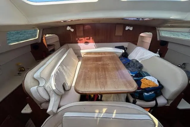 Slide: The Image of Interior of 2013 Gemini Legacy boat with dining area and seating. - 31