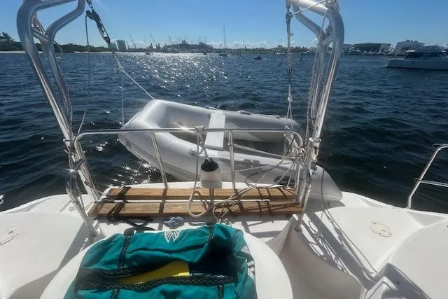Slide: The Image of Sailboat deck view with dinghy on water, Gemini Legacy 2013 model. - 35