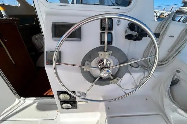 Slide: The Image of Steering wheel of 2013 Gemini Legacy boat with control panel and gauges. - 37