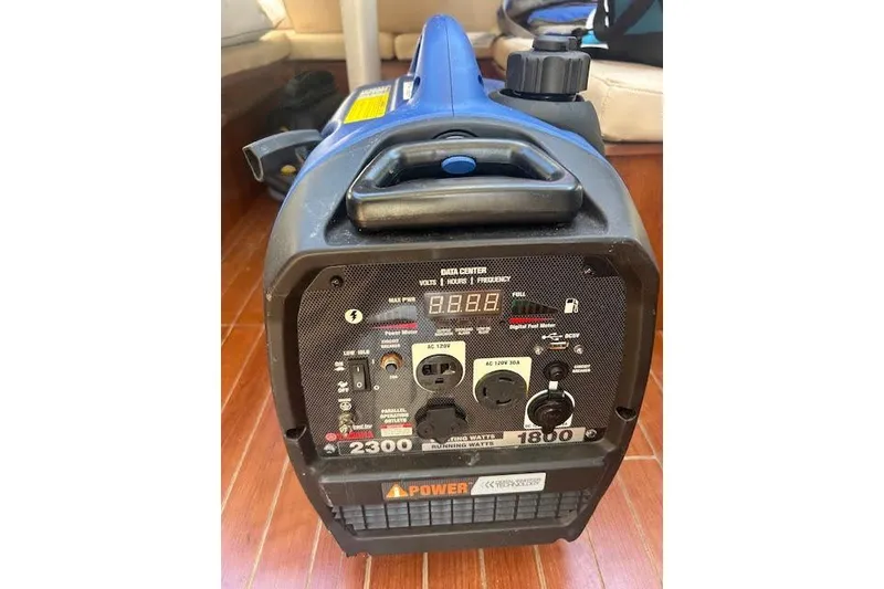 Slide: The Image of Portable Gemini Legacy 2013 generator with control panel and power outlets on wooden floor. - 40