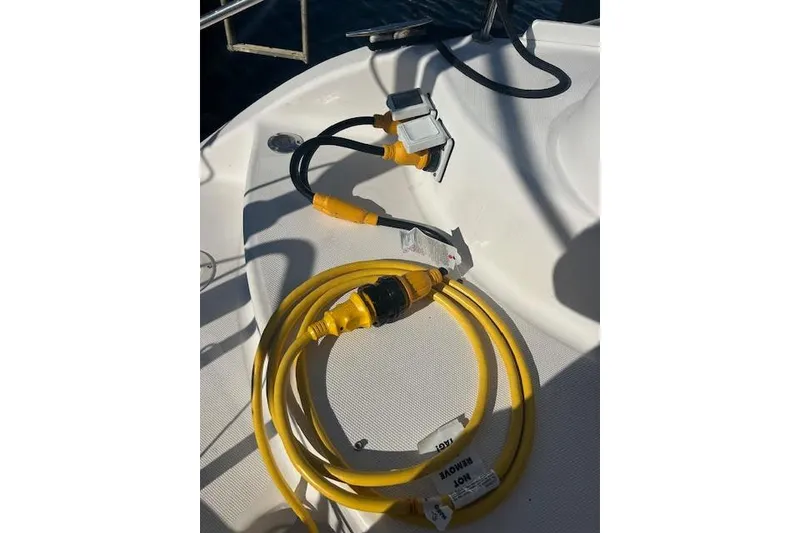 Slide: The Image of Yellow power cables on a 2013 Gemini Legacy boat deck. - 41