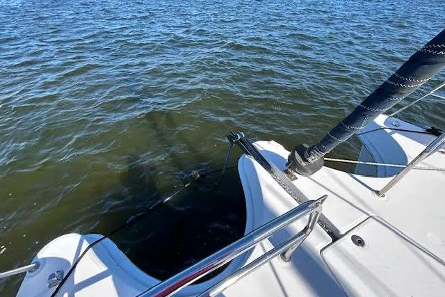 Slide: The Image of Interior of 2013 Gemini Legacy boat with wooden cabinetry and kitchen area. - 8