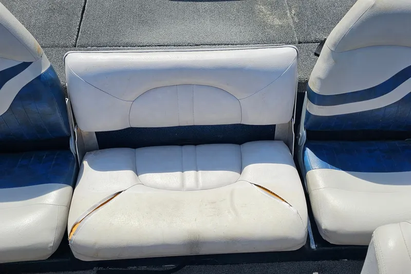 Slide: The Image of Worn seating on 2004 ProCraft 180 Combo boat, showing visible tears and wear. - 17