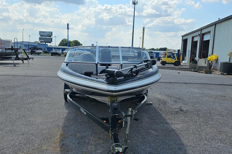 Slide: The Image of 2004 ProCraft 180 Combo boat on trailer in outdoor lot. - 2