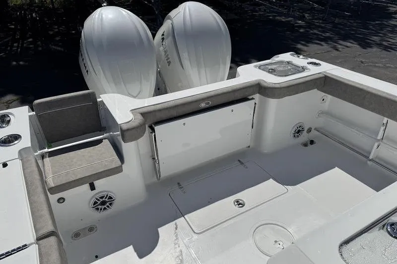 Slide: The Image of 2026 Sea Hunt Gamefish 30 boat interior with dual Yamaha engines, forward seating. - 12