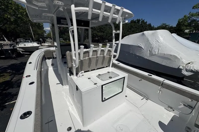 Slide: The Image of 2026 Sea Hunt Gamefish 30 Forward Seating boat with rod holders and center console. - 16