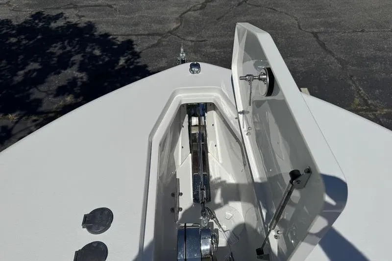 Slide: The Image of 2026 Sea Hunt Gamefish 30 Forward Seating boat anchor compartment, open lid view. - 7