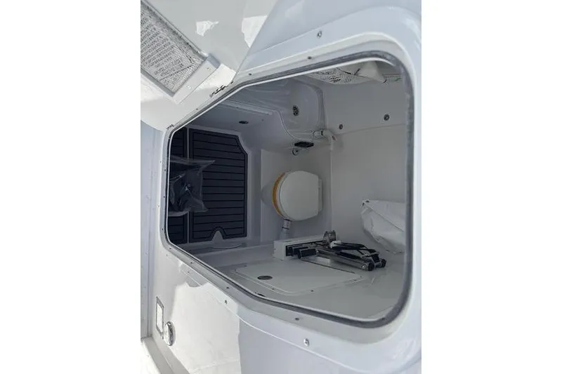Slide: The Image of 2026 Sea Hunt Gamefish 30 Forward Seating boat interior storage compartment. - 8