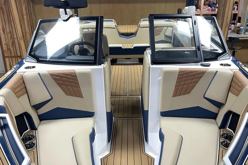 Slide: The Image of 2025 Nautique Super Air Nautique S23 interior with luxurious seating and modern design. - 4