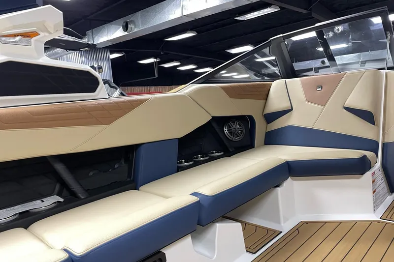Slide: The Image of 2025 Nautique Super Air Nautique S23 interior with luxurious seating and modern design. - 8