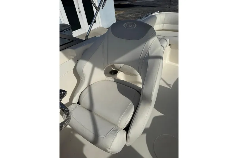 Slide: The Image of 2023 Key West 203 DFS boat seat with white upholstery and ergonomic design. - 16