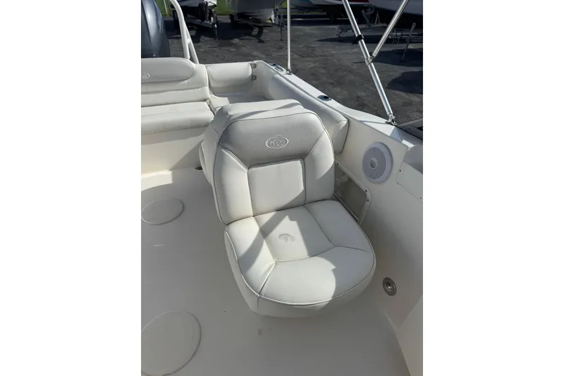 Slide: The Image of 2023 Key West 203 DFS boat interior with cushioned seating and speaker. - 17