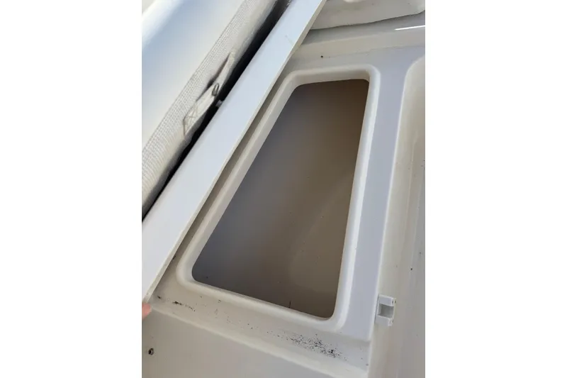 Slide: The Image of Open storage compartment on 2023 Key West 203 DFS boat. - 24