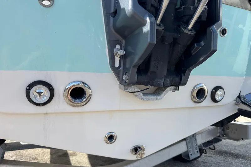 Slide: The Image of 2023 Key West 203 DFS boat transom with engine mount and drainage ports. - 33