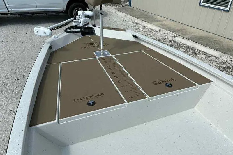 Slide: The Image of 2026 Xpress H210B boat deck with SeaDek flooring and measurement markings. - 10