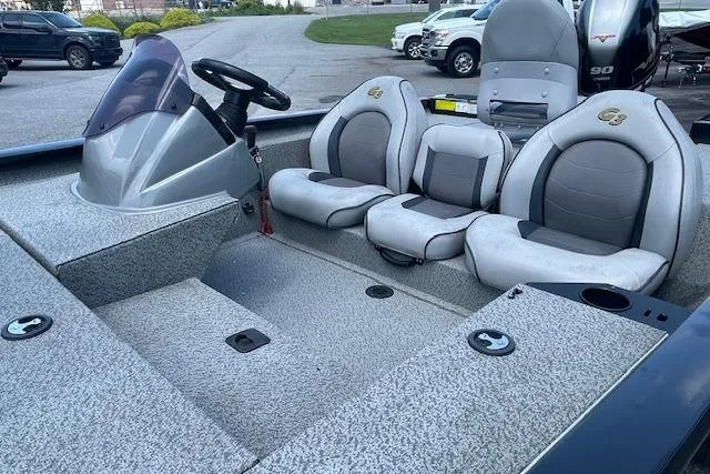 Slide: The Image of 2019 G3 Sportsman 1710 boat interior with seating and steering console. - 3