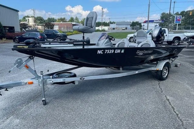 Slide: The Image of 2019 G3 Sportsman 1710 boat on trailer, parked outdoors. - 4