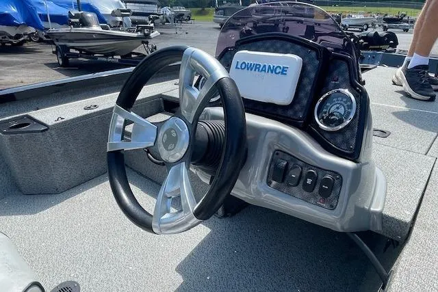 Slide: The Image of 2019 G3 Sportsman 1710 boat dashboard with steering wheel and Lowrance display. - 7