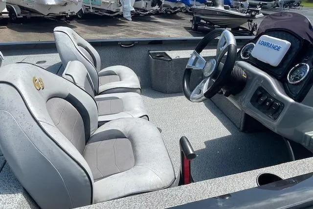 Slide: The Image of 2019 G3 Sportsman 1710 boat interior with steering wheel and seating. - 9