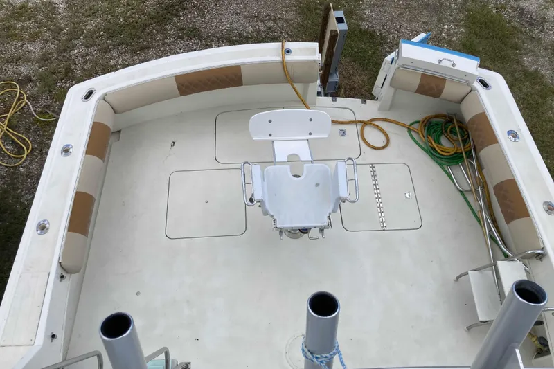 Slide: The Image of 1985 Hatteras Sportfish boat deck with seating and fishing chair, viewed from above. - 18