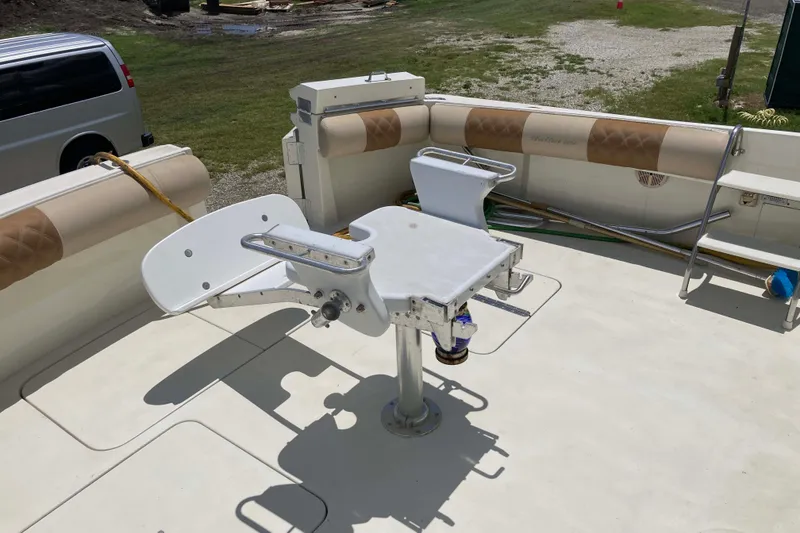 Slide: The Image of 1985 Hatteras Sportfish boat deck with fishing chair and seating area. - 6