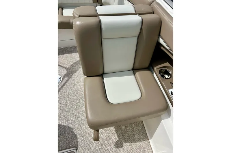 Slide: The Image of Brown and white seat on 2008 Searay SX 232 boat, featuring cup holder. - 13