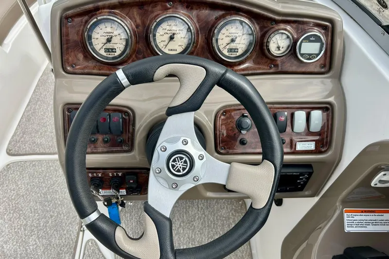 Slide: The Image of Steering wheel and dashboard of 2008 Searay SX 232 boat with Yamaha gauges. - 24