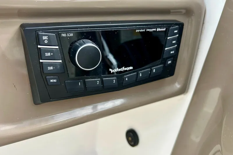 Slide: The Image of Rockford Fosgate audio system in 2008 Searay SX 232 boat dashboard. - 25