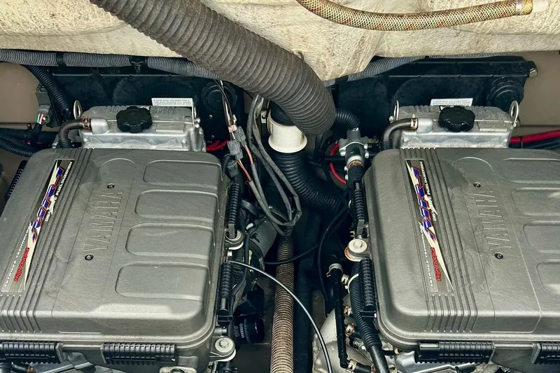 Slide: The Image of Twin Yamaha engines in a 2008 Searay SX 232 boat, showcasing detailed engine components. - 30
