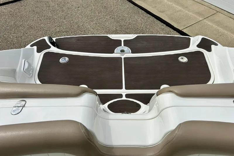 Slide: The Image of 2008 Searay SX 232 boat deck with brown and white detailing. - 34