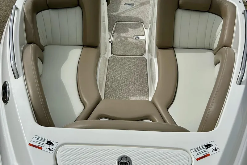 Slide: The Image of 2008 Searay SX 232 boat interior with beige and white seating. - 36