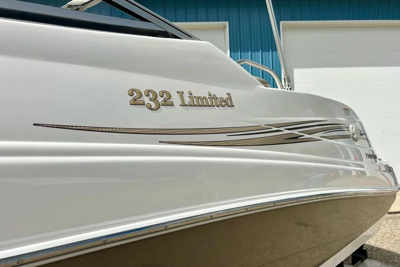 Slide: The Image of 2008 Searay SX 232 Limited boat with sleek design and stylish graphics. - 41