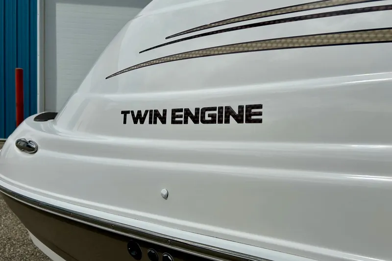 Slide: The Image of 2008 Searay SX 232 boat with "Twin Engine" label on the stern. - 6