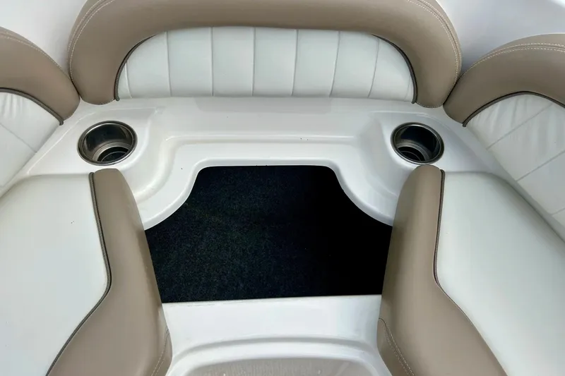 Slide: The Image of Interior seating of a 2008 Searay SX 232 boat with cup holders. - 8