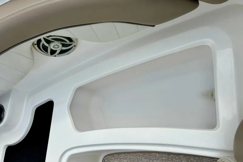Slide: The Image of Interior view of a 2008 Searay SX 232 boat, featuring seating and speaker. - 9