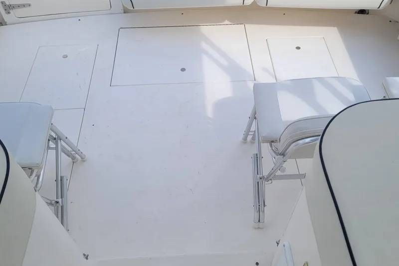 Slide: The Image of 1997 Wellcraft 330 Coastal boat deck with seating and storage compartments. - 11
