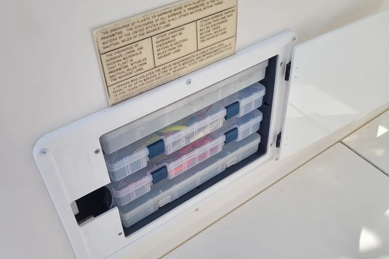 Slide: The Image of Storage compartment with tackle boxes on a 1997 Wellcraft 330 Coastal boat. - 15